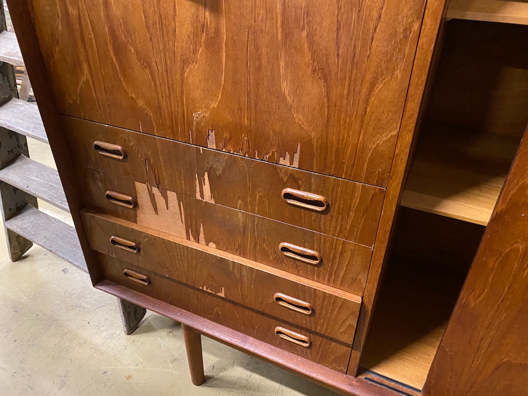 A mid century teak side cabinet (with faults), length 198cm, depth 45cm, height 121cm